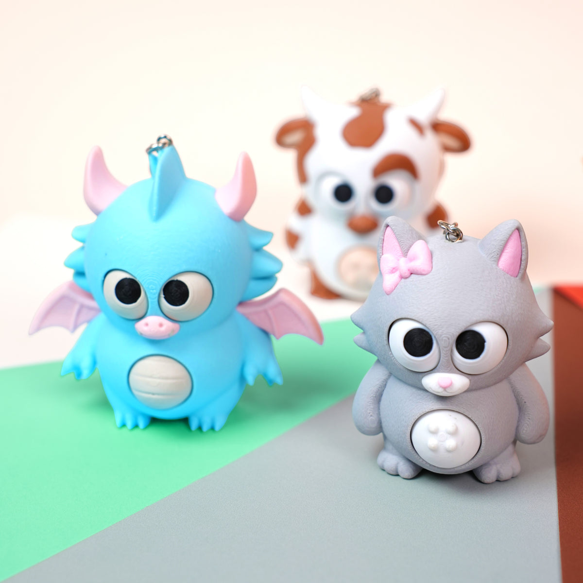 Móc Khóa Twisty Pets – Mắt & Bụng Xoay Linh Hoạt